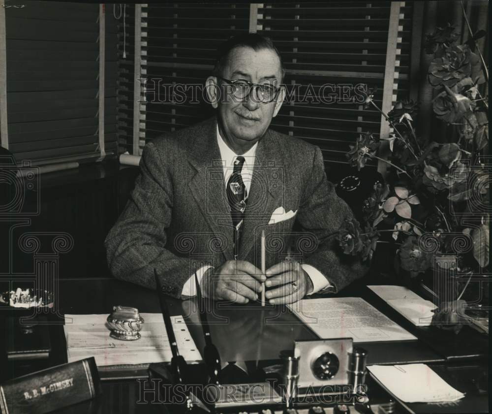 1954 Chairman B.B. McGimsey sits at desk-Historic Images