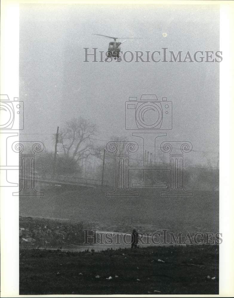 1990 Police helicopter searching for possible drowning victim, Texas-Historic Images