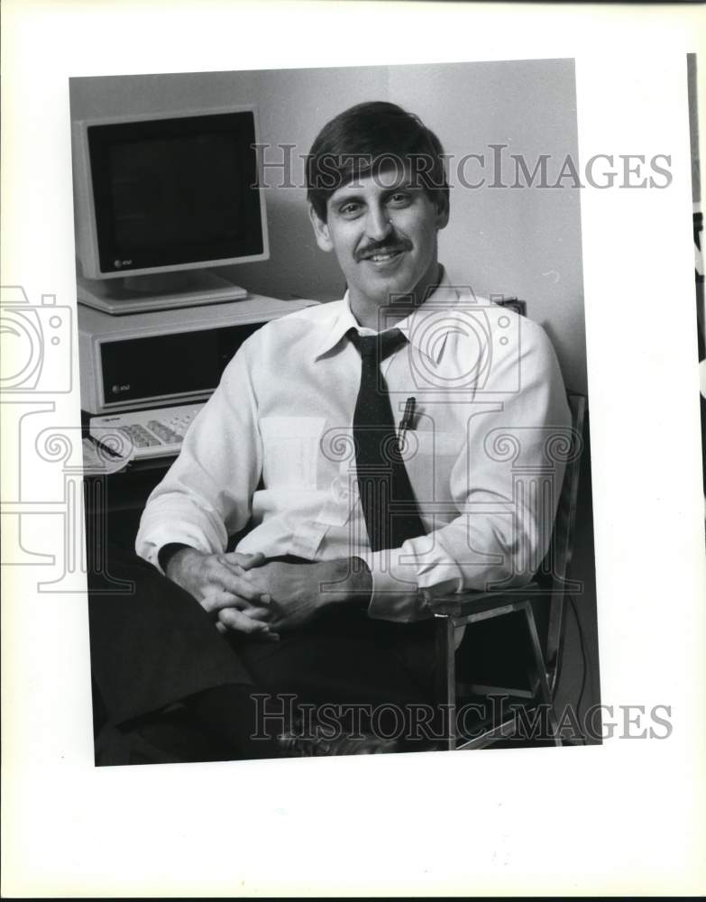 1987 Robert Marbut Jr. sitting next to computer-Historic Images