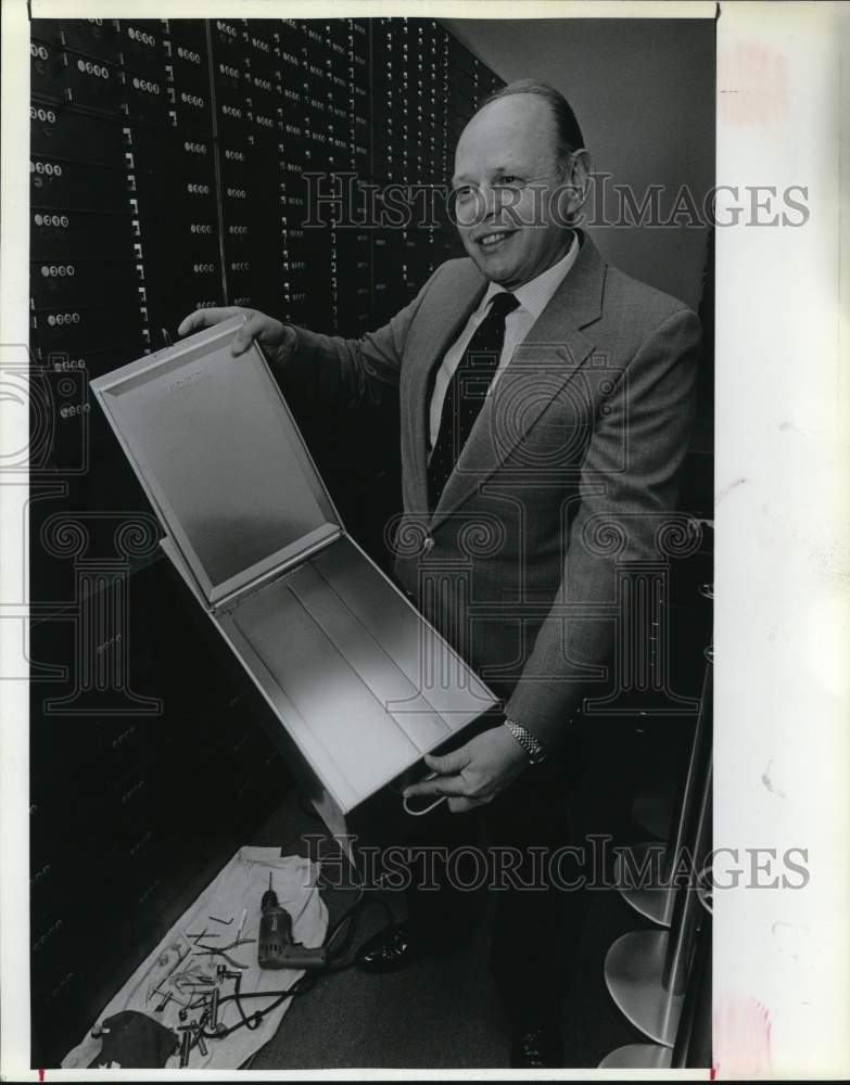 1989 James A. Hubbart shows an empty box after it was drilled open-Historic Images