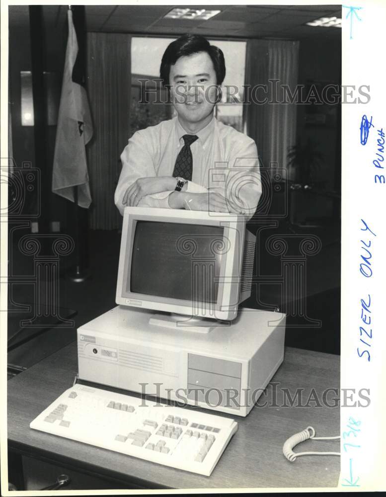 1989 Michael Michigami standing next to computer at Datapoint, Texas-Historic Images