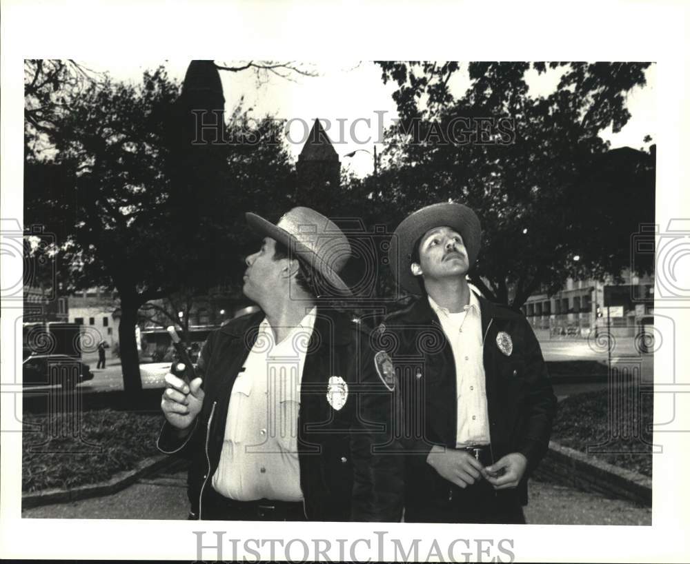 1989 Park Rangers looking for grackels in Main Plaza, Texas-Historic Images