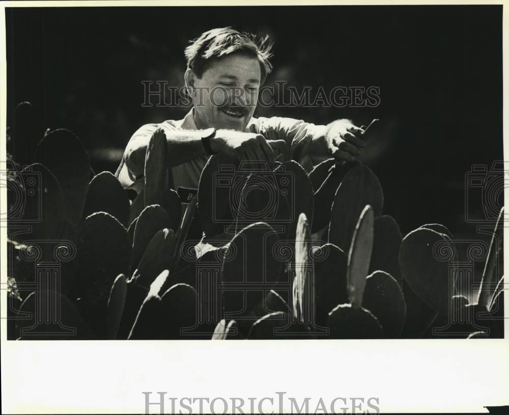 1987 Horticulturist Bill Miller with cactus at The Alamo-Historic Images