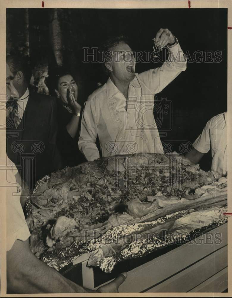 1979 John White Digs Into 65-Pound Taco, Joyce Peters Cheers Him On-Historic Images