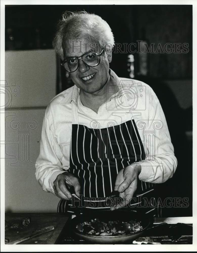 Jack Lirio Shows The Food He Is Cooking-Historic Images