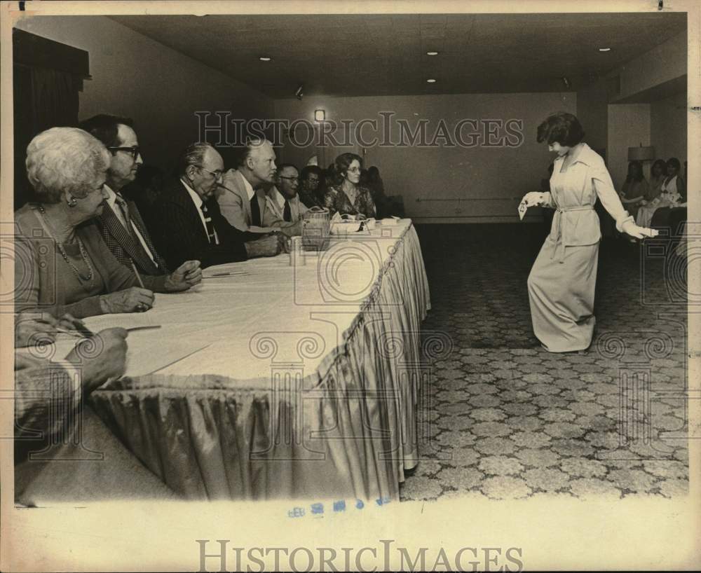 1977 Sandra Luna, Miss Fiesta contestant, talking to judges, Texas-Historic Images
