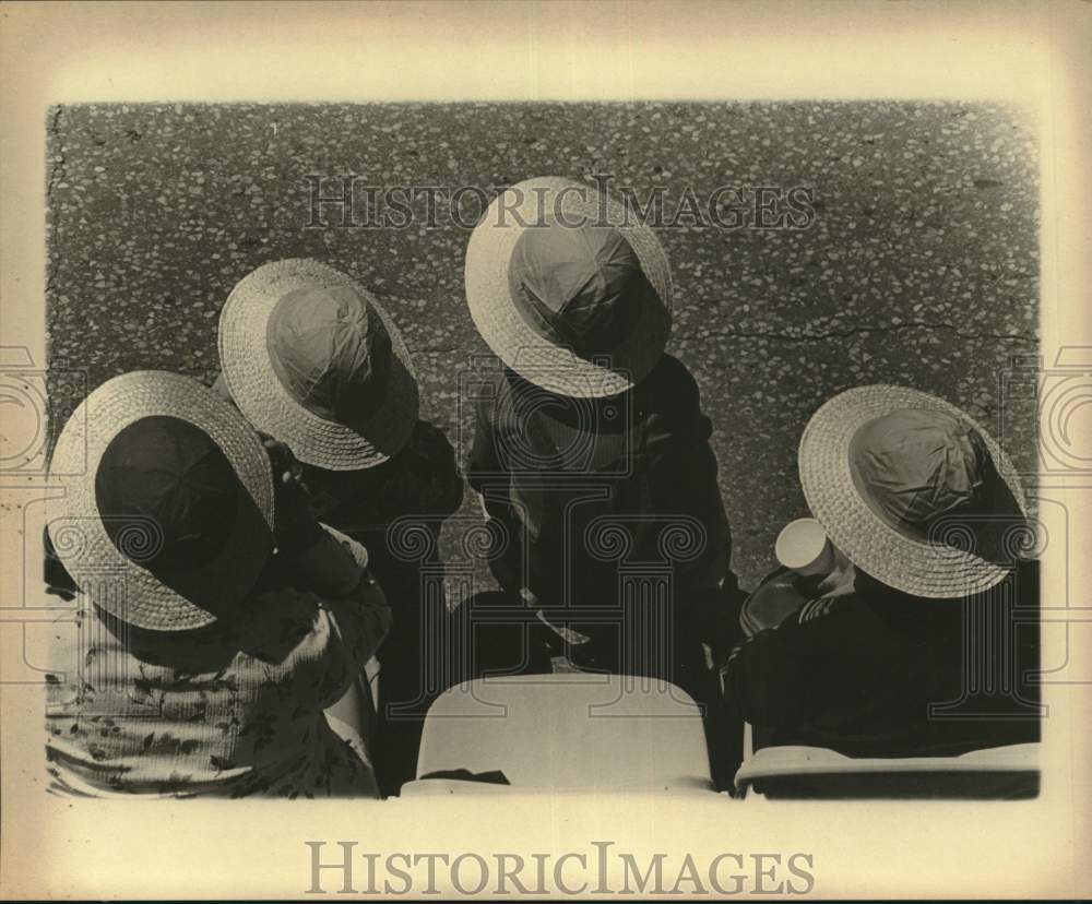 Press Photo Group wearing hats - saa86940- Historic Images