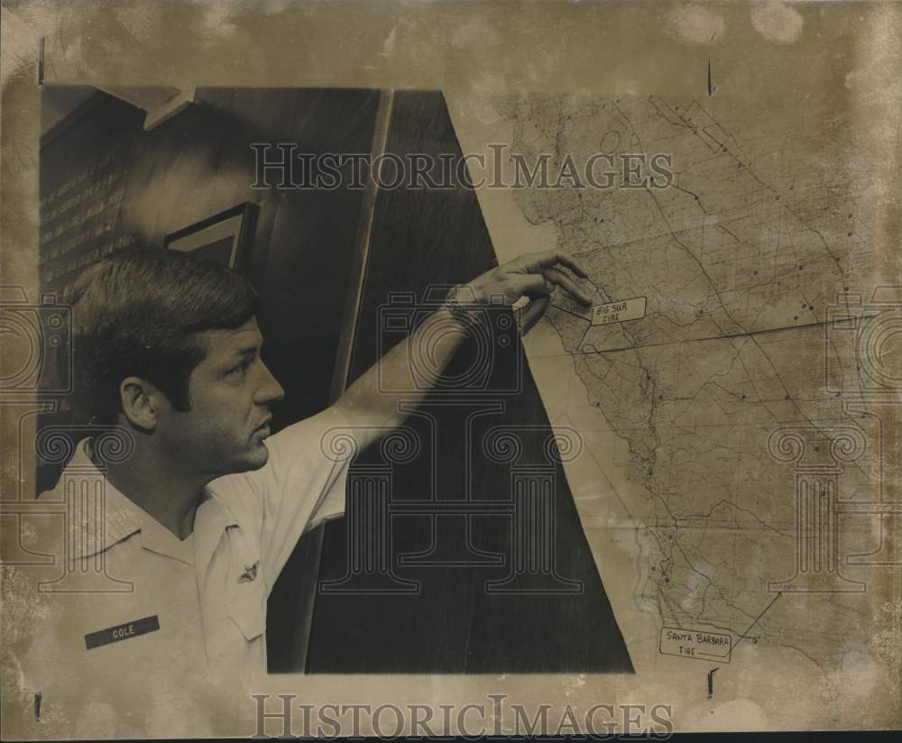 1977 Captain Bill Cole looking at Big Sur Fire area on map, Texas-Historic Images