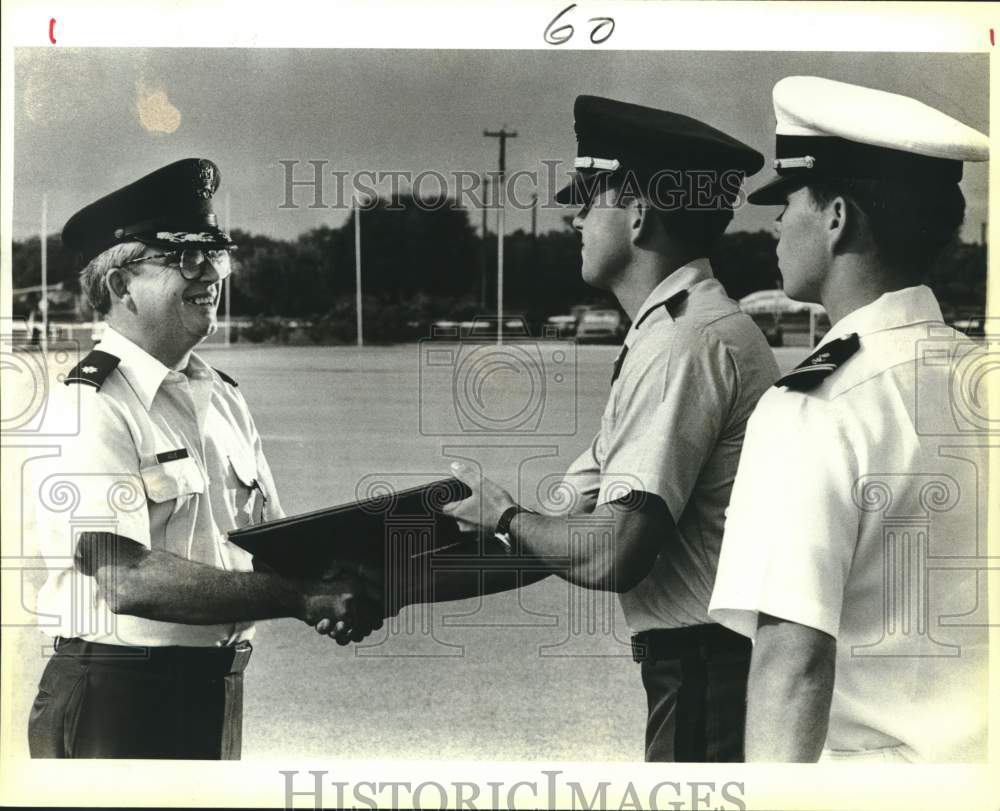 1987 Lt. Col. Walter N. Ague receives retirement certificate, Texas-Historic Images