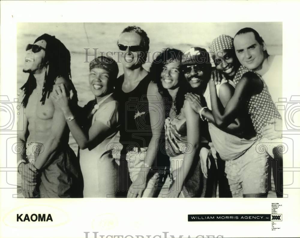 Press Photo Seven Members of the band Kaoma smiling and embracing - Historic Images