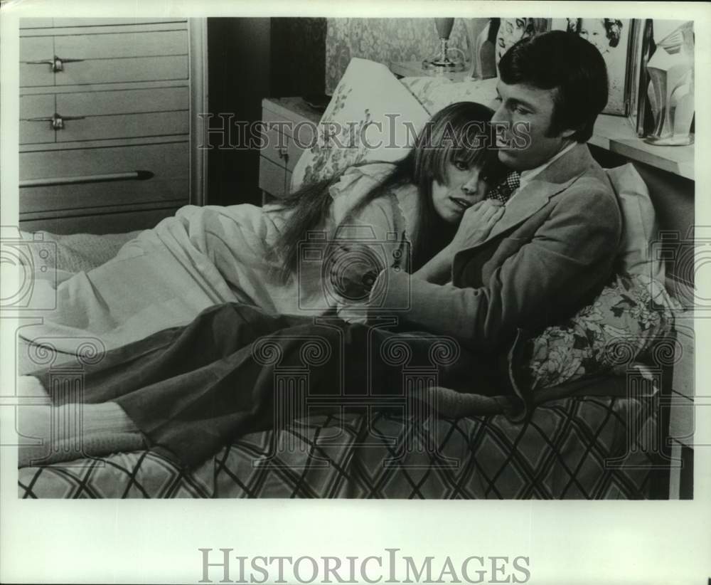 Actress Louise Lasser lays on bed with co-star in scene of show - Historic  Images