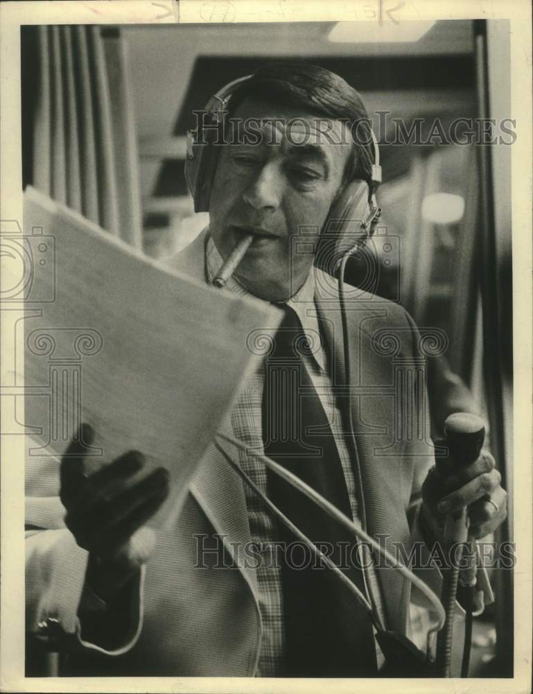 1979 Press Photo Television Host Howard Cosell smokes cigar with headphones on- Historic Images