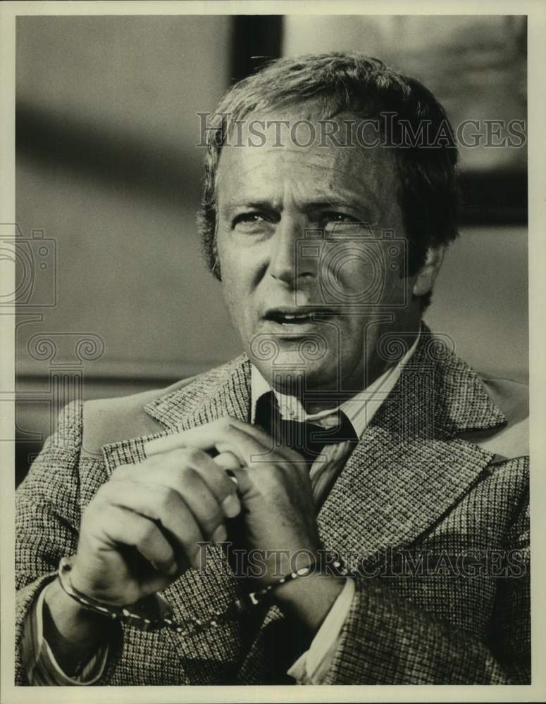 Press Photo Actor Greg Eusgan in handcuffs in closeup portrait - Historic Images