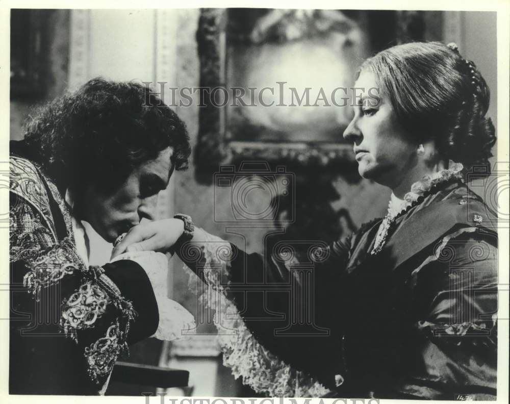 Actor Ian McShane kissing hand of co-star - Historic Images