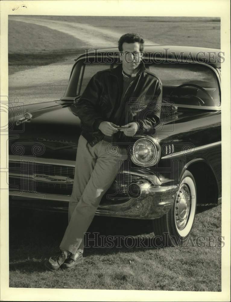 Press Photo Actor James Naughton leans against hood of car - Historic Images