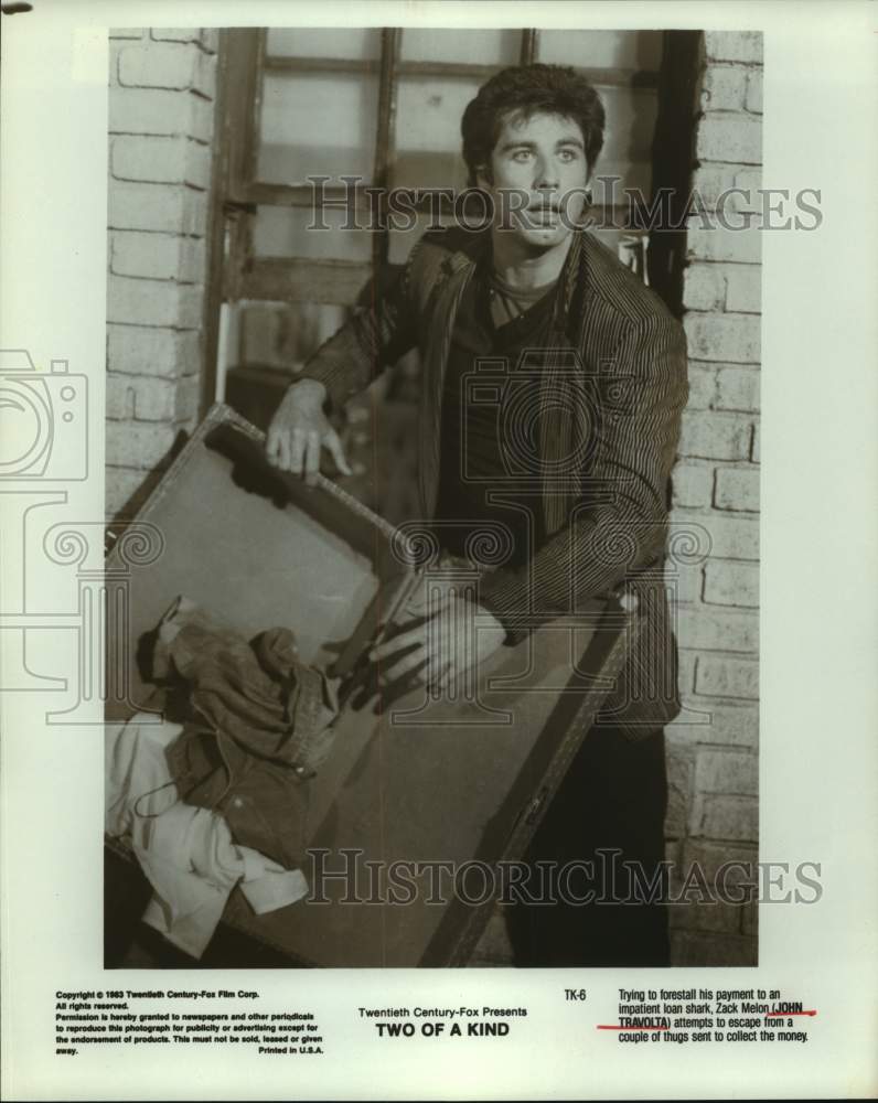 1983 Press Photo John Travolta in a scene from Two of a Kind. - Historic Images