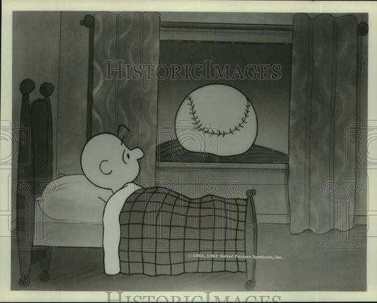 1952 Press Photo Charlie Brown looking out window at "baseball" moon - Historic Images