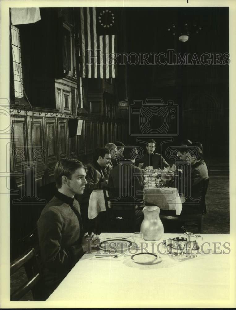 Press Photo Actor Sits Alone at Mess Hall Table in Period Military Costume - Historic Images