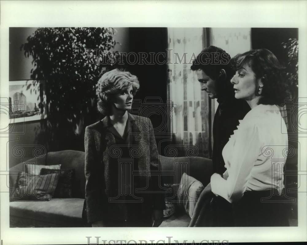 Press Photo Two Women & Man in Living Room - Historic Images