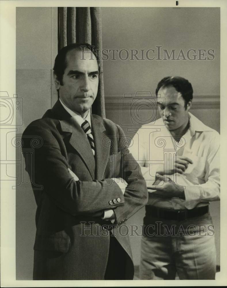 Press Photo Man Turns His Back as Other Man Dresses - Historic Images