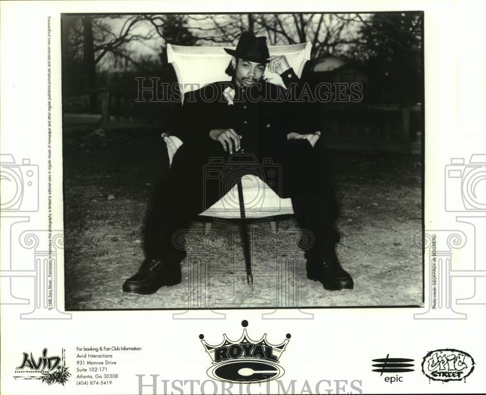 1996 Press Photo Musician Royal C Poses Outdoors in Chair With Cane - Historic Images