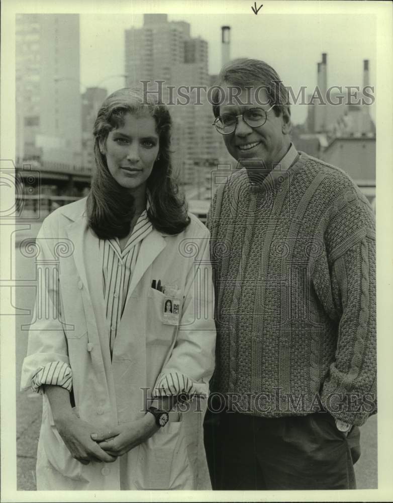 Man &amp; Woman Pose in Front of City Skyline - Historic Images