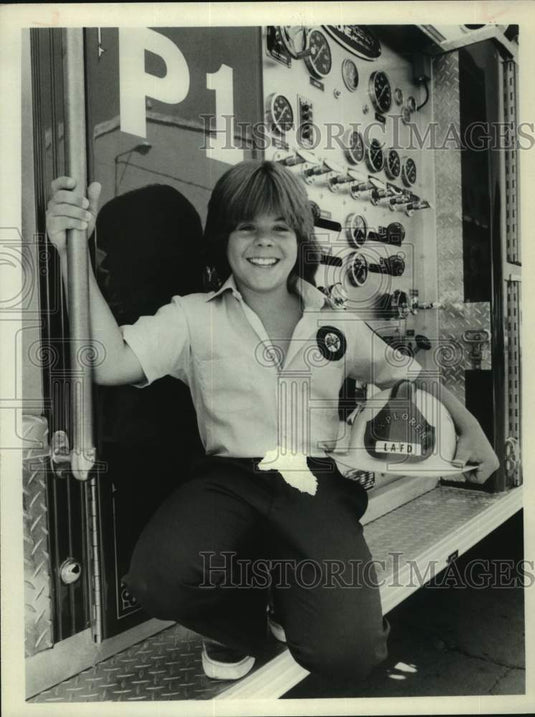Press Photo Actor Adam Rich on Back of Fire Truck in Film "Code Red" - Historic Images
