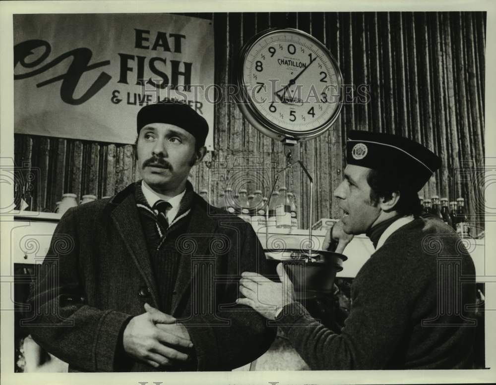 Press Photo Two Actors Perform Fish Market Scene - Historic Images