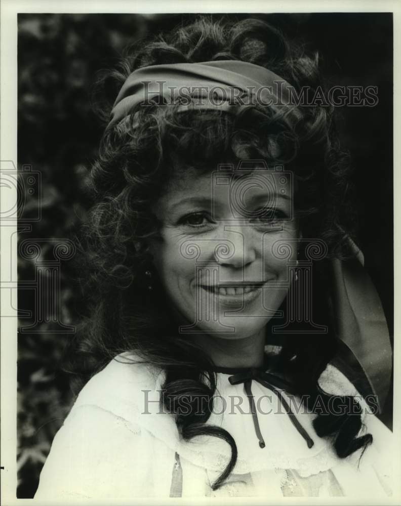 Press Photo Woman With Curly Hair Wears Scarf Headband - Historic Images