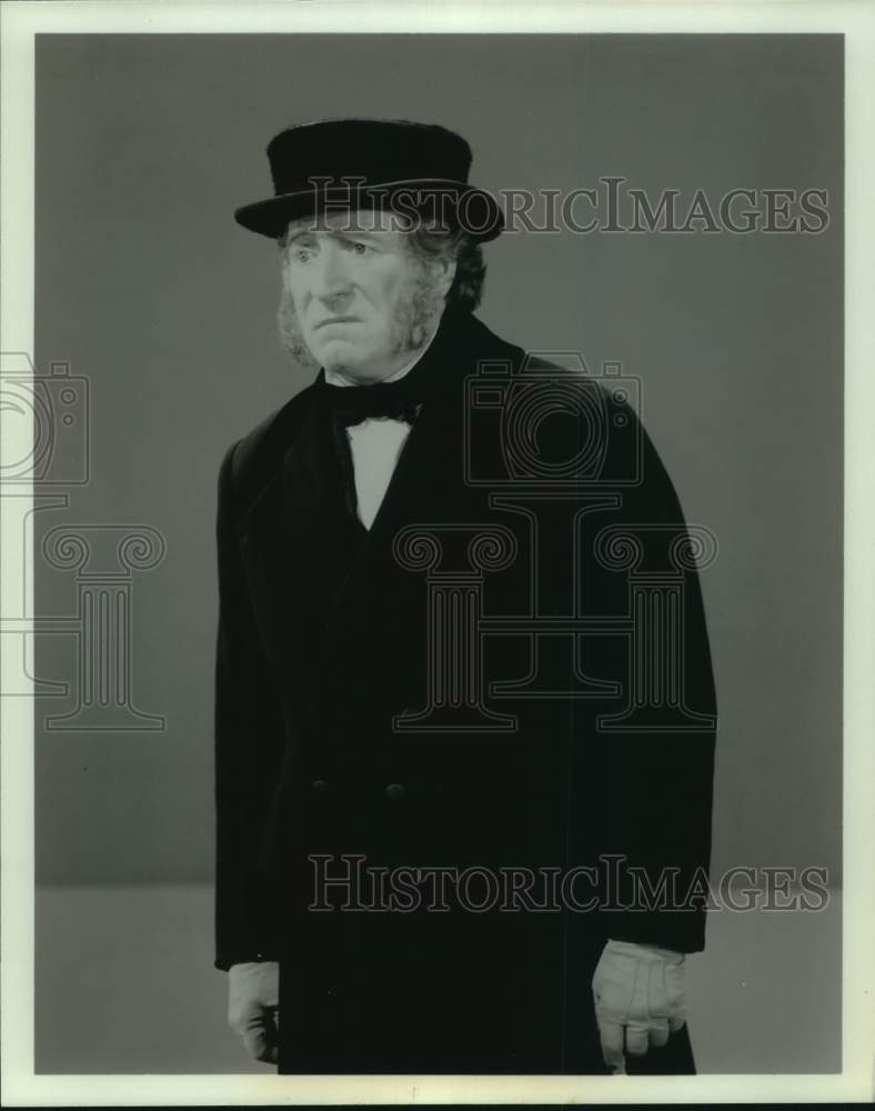 Press Photo Actor with Long Sideburns in Period Overcoat & Hat - Historic Images