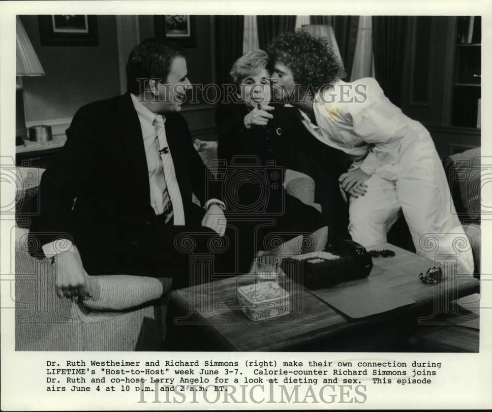 Press Photo Richard Simmons Kisses Dr. Ruth Westheimer as Larry Angelo Watches - Historic Images