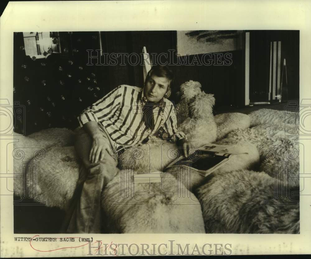 Playboy Gunter Sachs Reclines on Bed with Dog-Historic Images