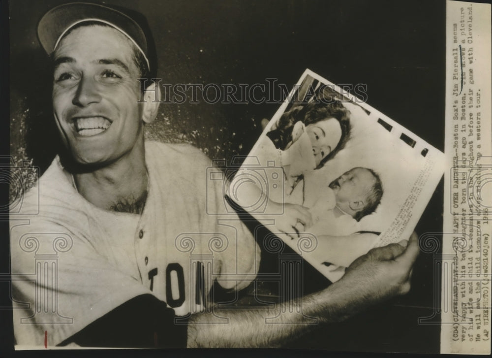 1956 Press Photo Jim Piersall holds picture of his baby before game in Cleveland- Historic Images