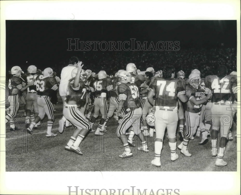 Huskies High School Football Players Celebrate on the Field-Historic Images