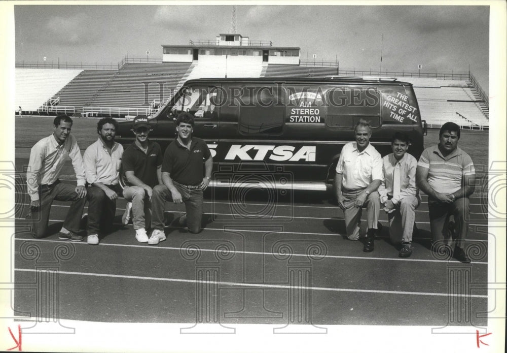 KTSA AM Stereo Station team kneels with the van-Historic Images