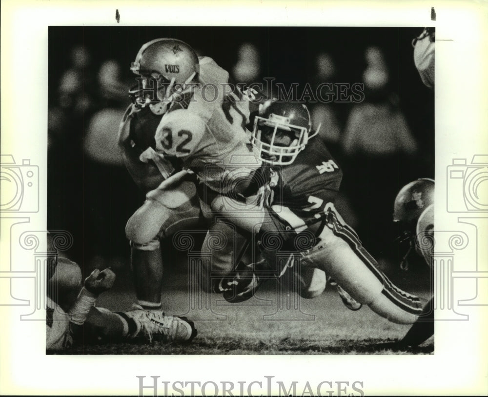 1989 Press Photo Lee and Roosevelt High School Football Players at Game Tackle - Historic Images
