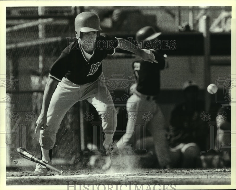 1989 Press Photo Madison High baseball player Joseph Chapman bunts vs. Judson - Historic Images