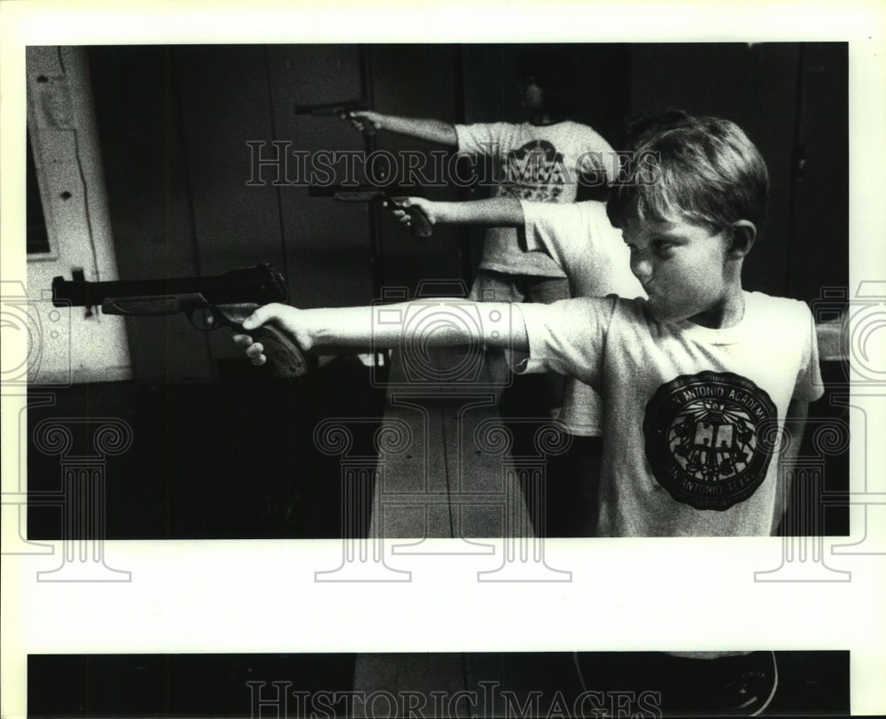 Press Photo Christopher Howell Shoots BB Gun at Junior Pentathlon - sas13465 - Historic Images