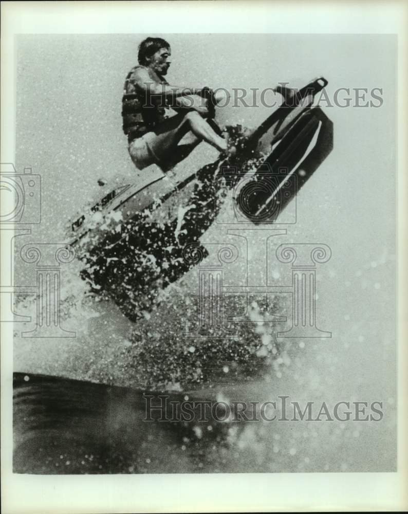 Press Photo A rider jumps a wave on a Power Ski watercraft - sas16019 - Historic Images