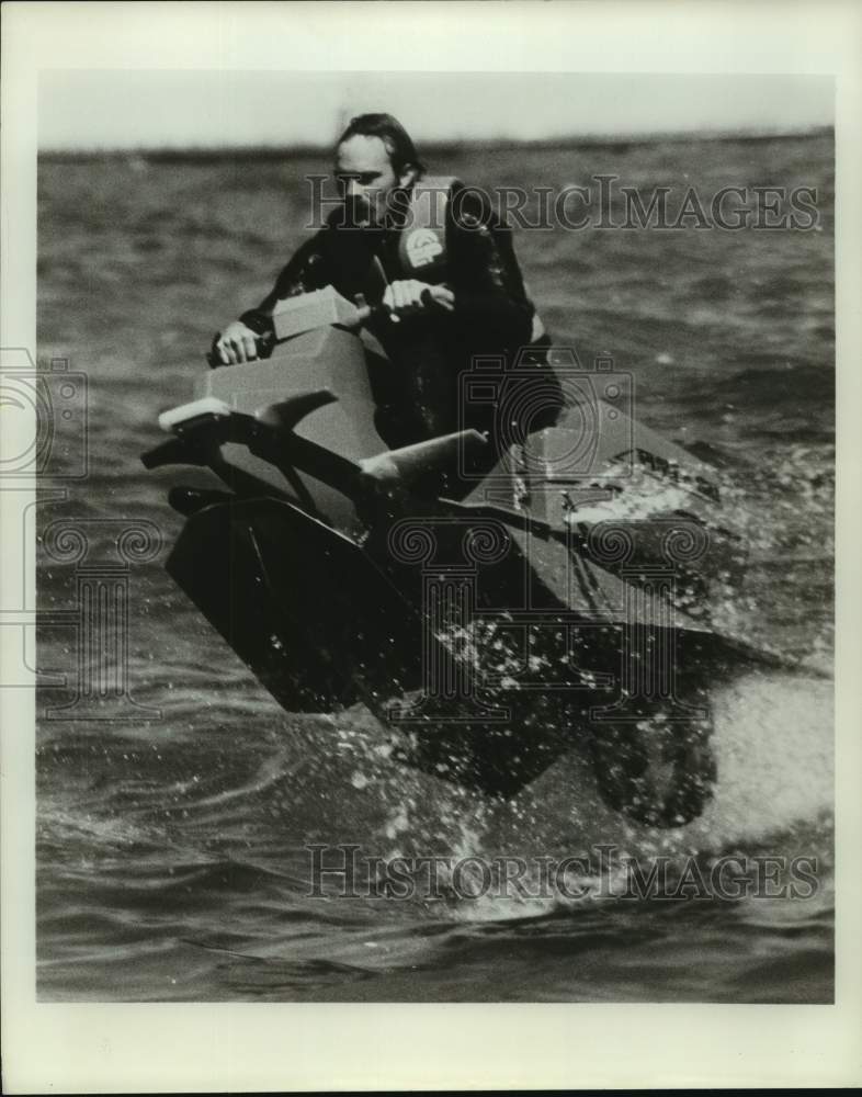 Press Photo A rider goes airborne with a personal watercraft - sas16020 - Historic Images