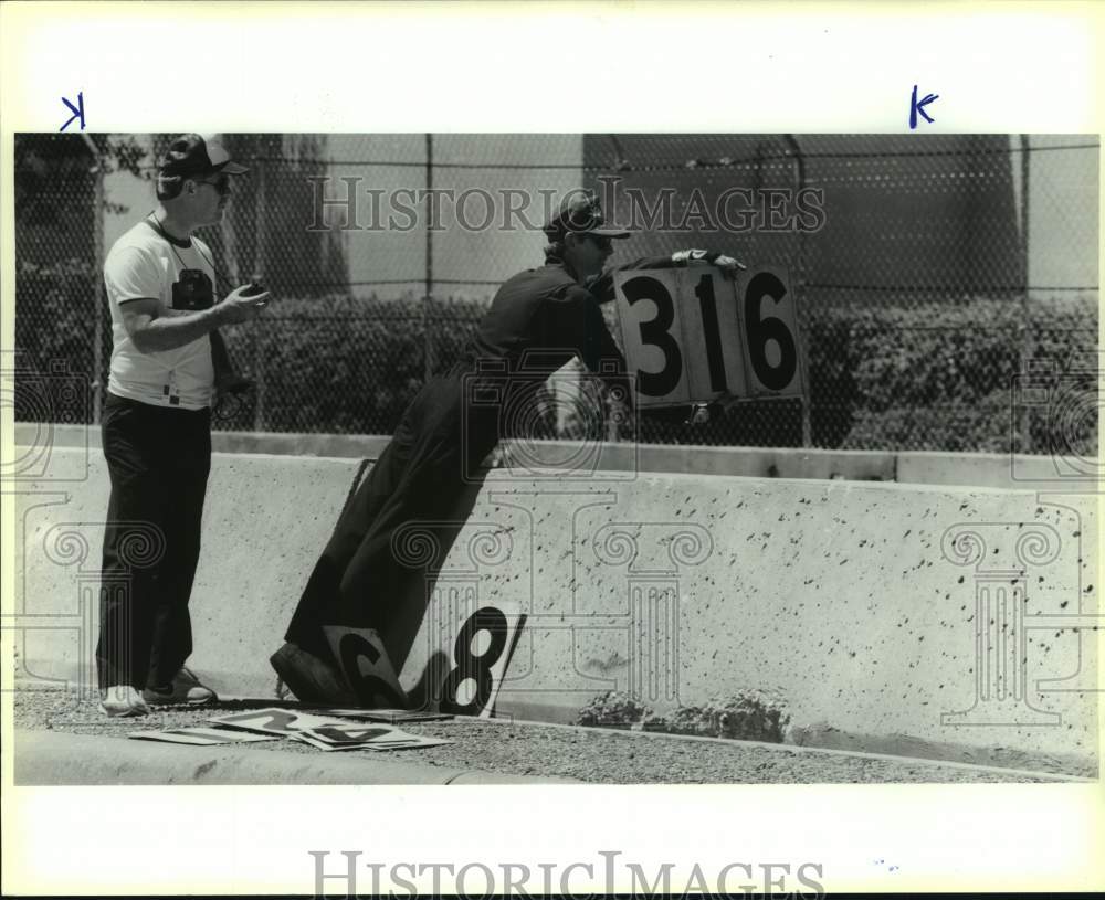 1989 Press Photo Timers relay information to drivers during Nissan Grand Prix - Historic Images