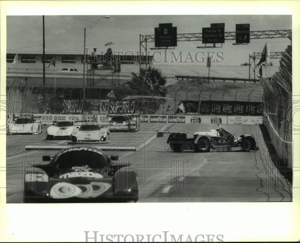 1989 Press Photo Rene Herzog of Switzerland crashes during Nissan Grand Prix - Historic Images