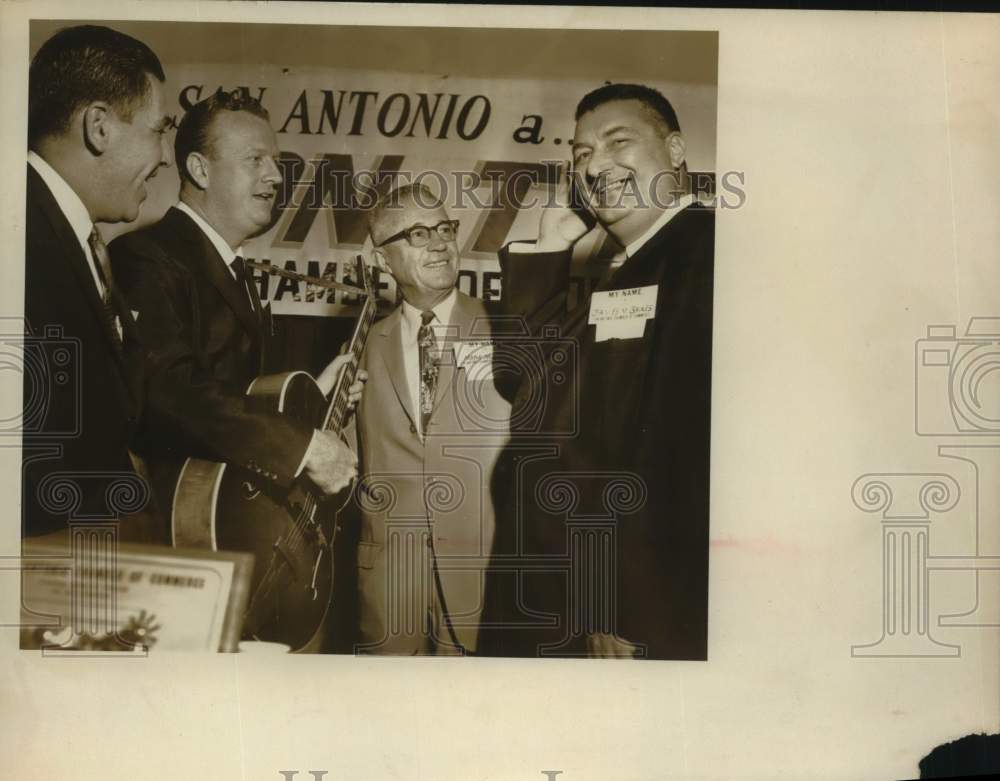 1963 Press Photo Red McCombs with a guitar and colleagues - sas18173 - Historic Images