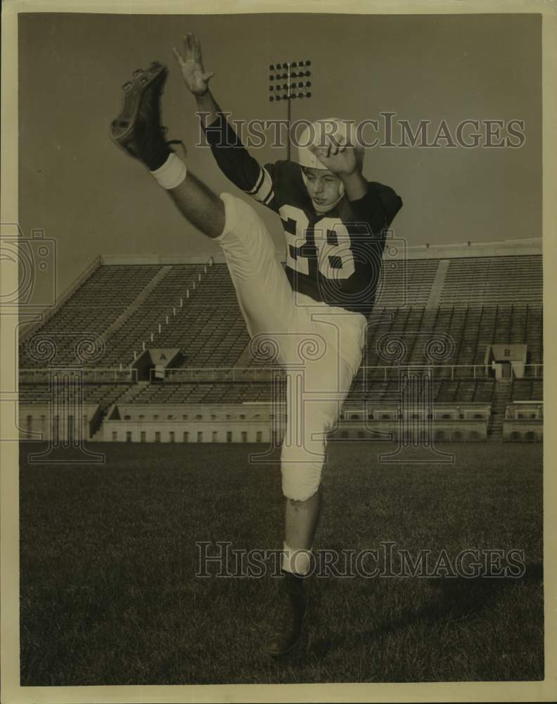 Press Photo Football Player Miles Willard High Kicks on Stadium Field - Historic Images
