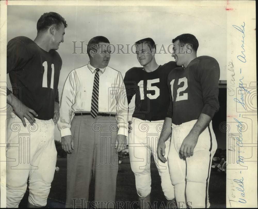 1955 Football Players Talk With Man in Shirt &amp; Tie on Field - Historic Images