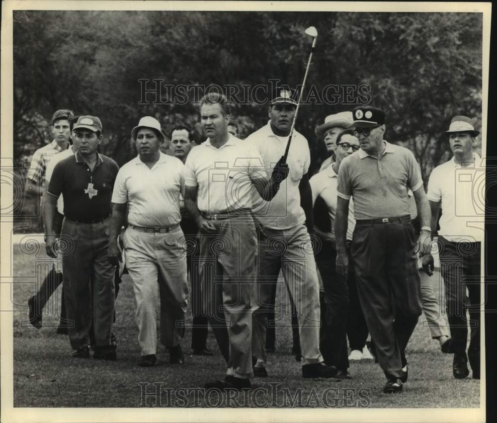 1966 Golfer Bill Johnston Watches Shot, Is Followed by Spectators - Historic Images