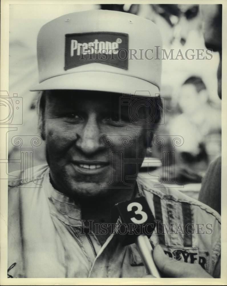 Race Car Driver Cale Yarborough Talks to Reporter in Prestone Hat - Historic Images