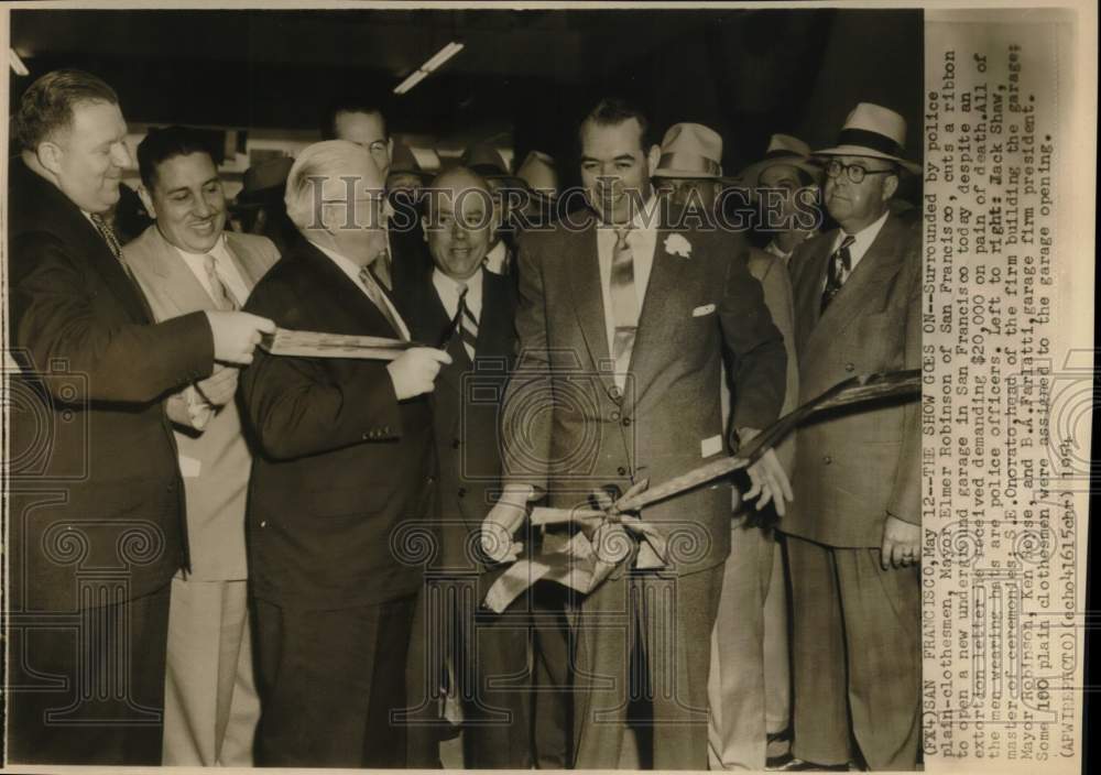 1954 Mayor Robinson cuts ribbon to new police garage, California-Historic Images