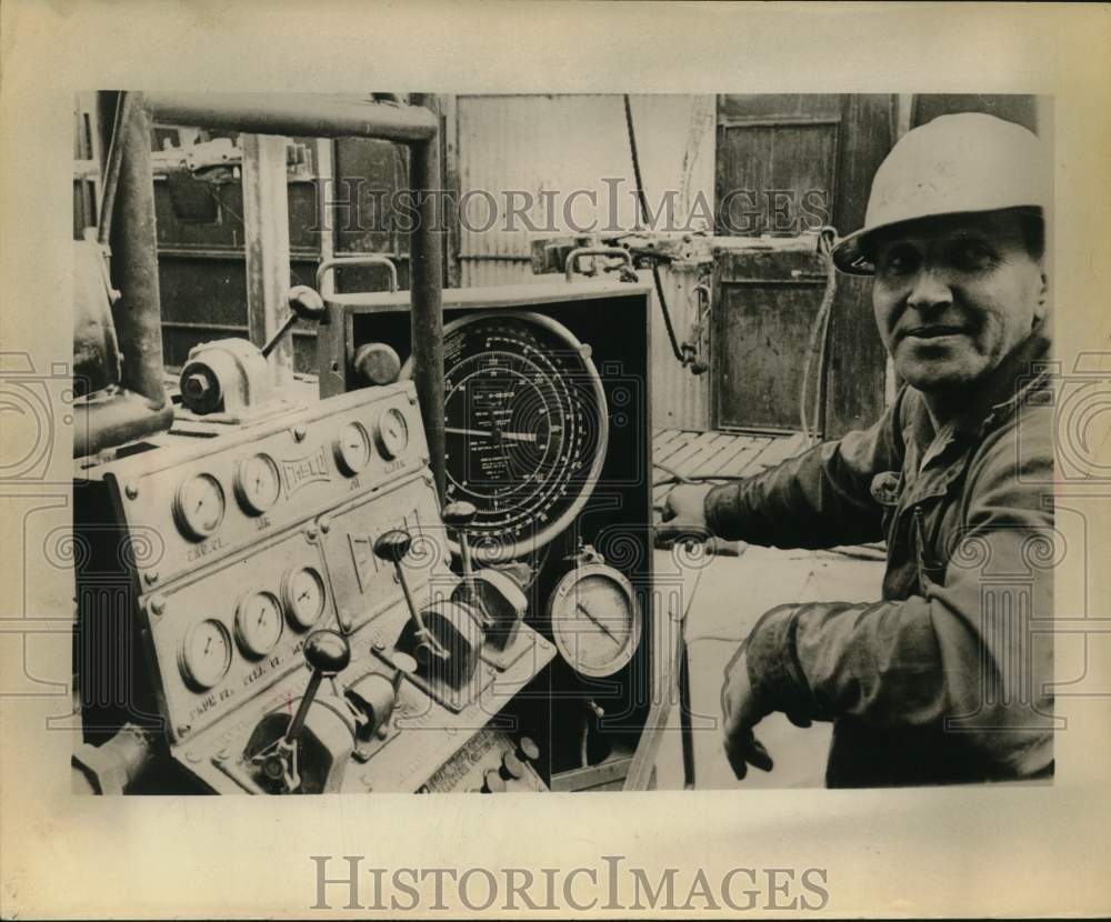 1958 Press Photo Alaskan oil worker at controls - sax16453 - Historic Images