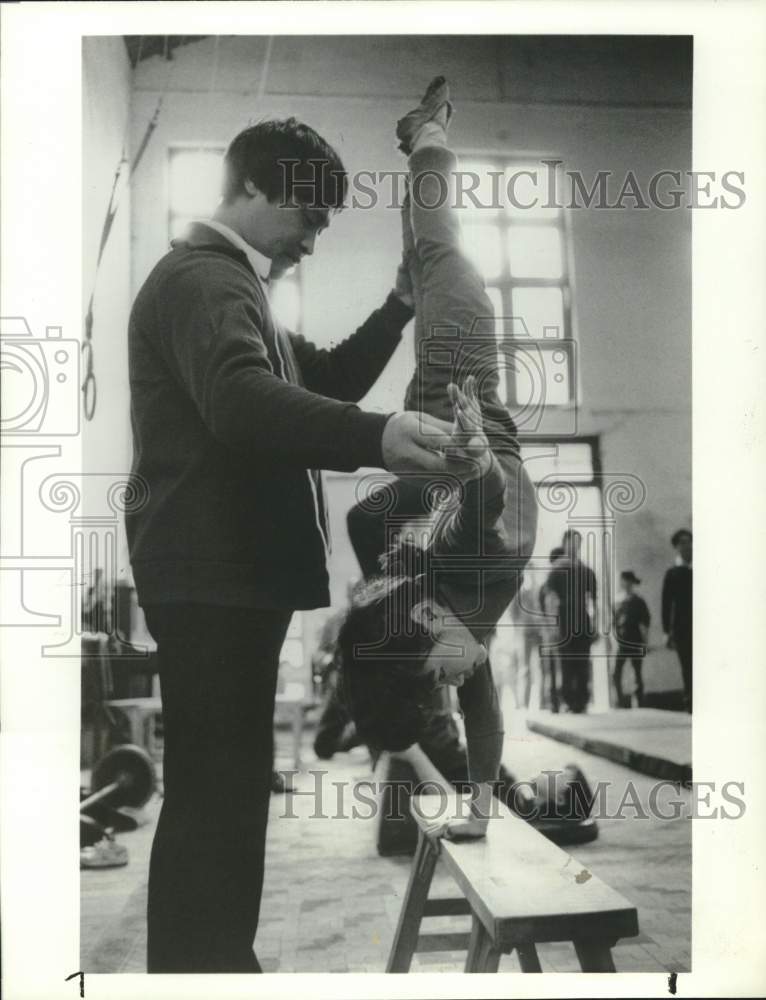 Press Photo Trainer works with a student at Acrobatic Training Center, Shanghai.- Historic Images